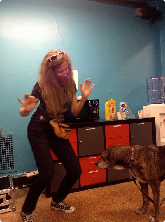 Lindsay, one of our membership directors, and Grin, her dog, go-go dancing to the Arcade Fire.